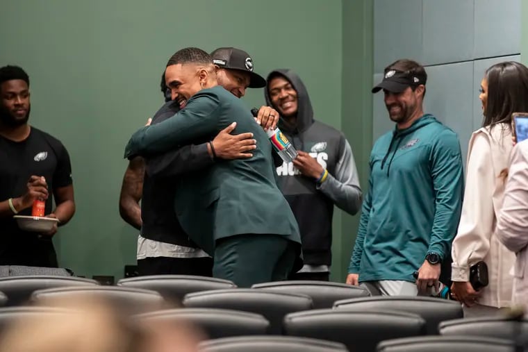 Eagles quarterback Jalen Hurts (right) has a long-standing relationship with Brian Johnson, who recently was promoted to offensive coordinator after serving as quarterbacks coach.