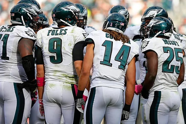 Philadelphia Eagles' Nick Foles huddles during the second half of an NFL football game against the St. Louis Rams, Sunday, Oct. 5, 2014, in Philadelphia. (Michael Perez/AP)