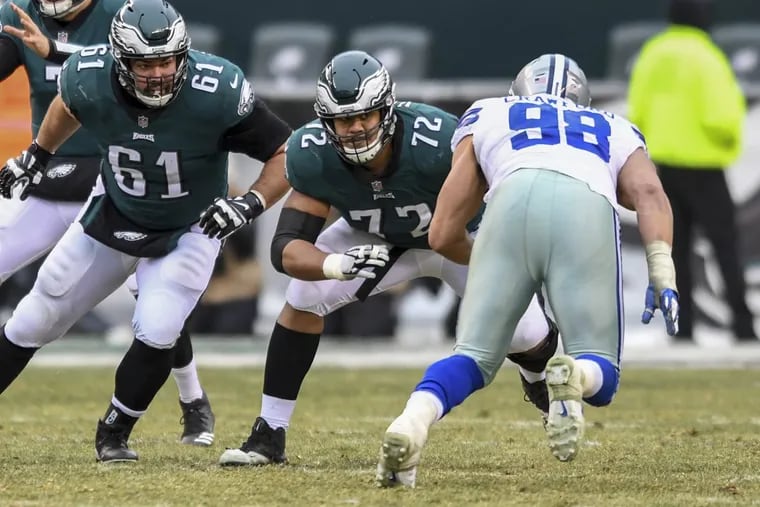 Eagles left tackle Halapoulivaati Vaitai (72) getting ready to block Cowboys defensive end DeMarcus Lawrence during a New Year’s Eve game.