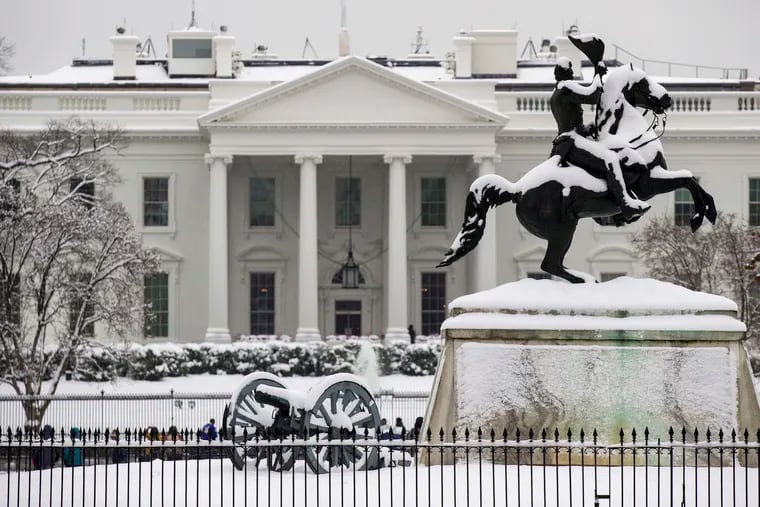 Snow blankets a statue of Andrew Jackson in Lafayette Square in Washington on Sunday; amounts to the  south were far heftier than they were around here.