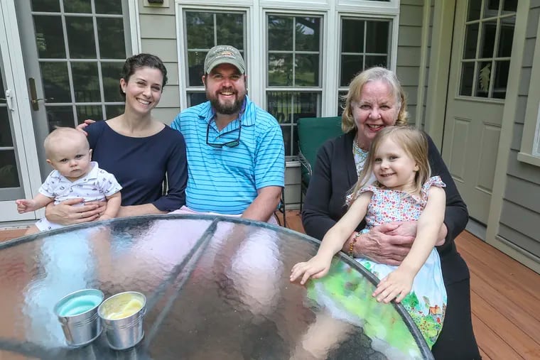 The Colket family — (from left) 8-month-old George, Maureen, Andrew, Mary, and Eleanor, 4 — live together in Westtown. Instead of selling the home Andrew grew up in, Mary moved into an apartment built onto the house, and Andrew, Maureen, and the children settled in the main house.
