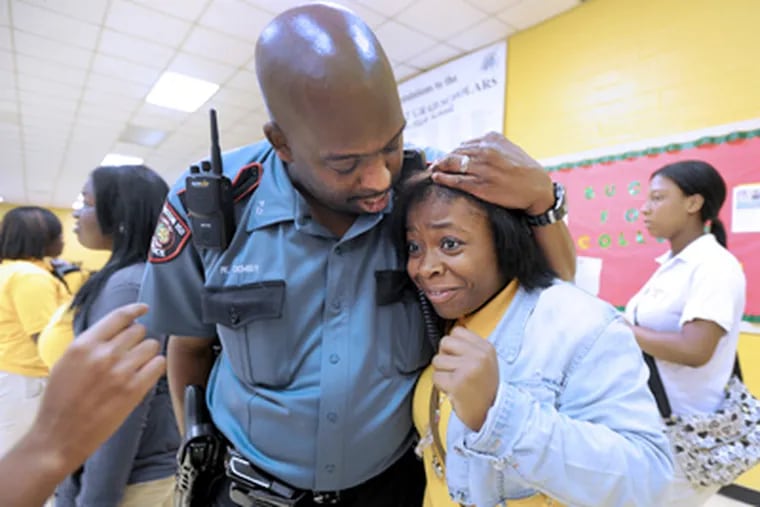 At Yates High School in Houston, school police officer Willie Demby Jr. jokes with a student. (Sharon Gekoski-Kimmel / Staff Photographer)