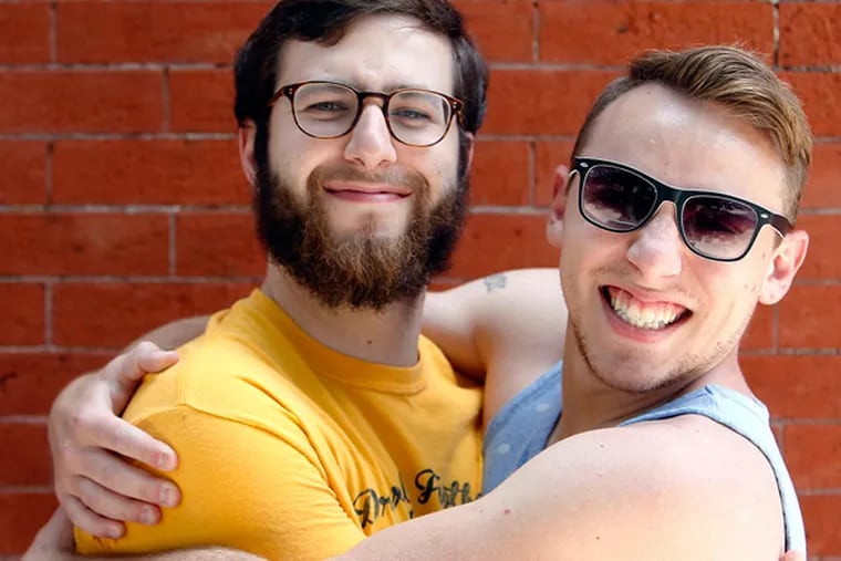 Joey Pasko (right) and friend Lucas Quagliata, both 24, hug. The rise in hugging can be directly traced to declines in homophobia, a sociologist says. But some are fending off the unwanted clinch. (Akira Suwa / Staff Photographer)