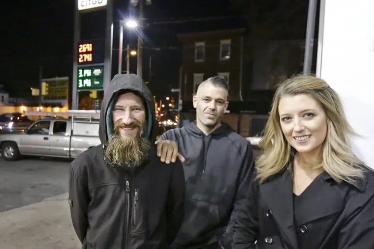 File photo of Johnny Bobbitt Jr. (left), Mark D'Amico, and Kate McClure at the CITGO station, where the trio falsely claimed Bobbitt used his last $20 to buy gas for a stranded McClure.