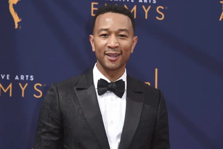 FILE – In this Sept. 9, 2018 file photo, John Legend arrives at the Creative Arts Emmy Awards in Los Angeles. Legend will become a coach on NBC's "The Voice."