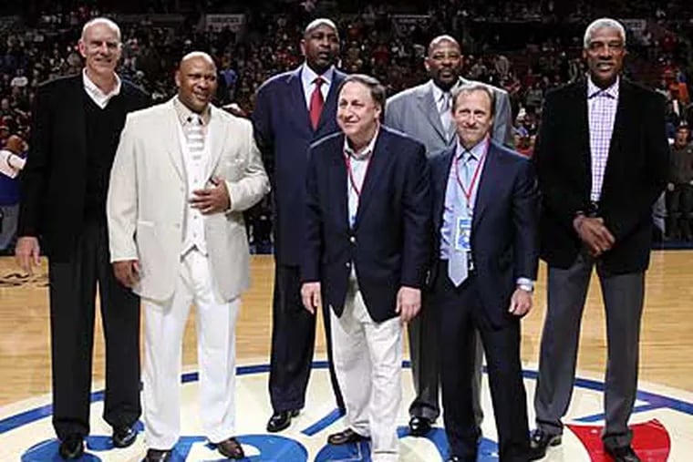 Members of the 76ers 1983 championship team pose with new owner Joshua Harris and CEO Adam Aron. (Steven M. Falk/Staff Photographer)