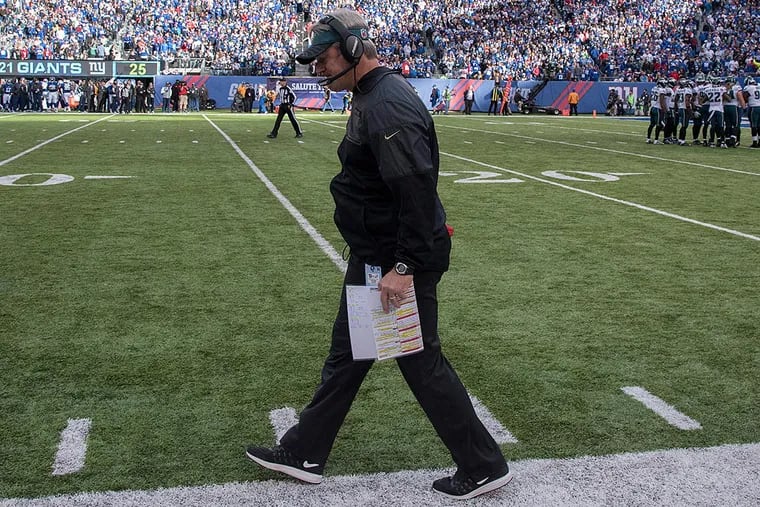 Doug Pederson walks back to the Eagles bench after his team failed to get a first down.