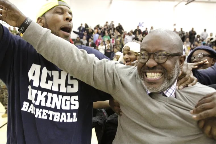 Former Atlantic City head coach Gene Allen (right) celebrates with fans after winning the Group 4 state semifinal in 2013.