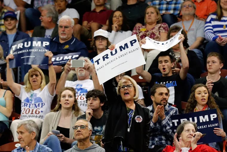 Donald Trump supporters cheer him in Harrisburg last week. Trump is riding a wave of GOP disgruntlement among the blue-collar whites of suburban Philadelphia, while among Democrats, Bernie Sanders is winning young supporters.