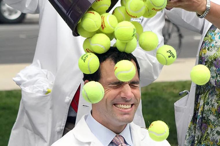Jefferson Hospital spins a new challenge bucket of tennis balls