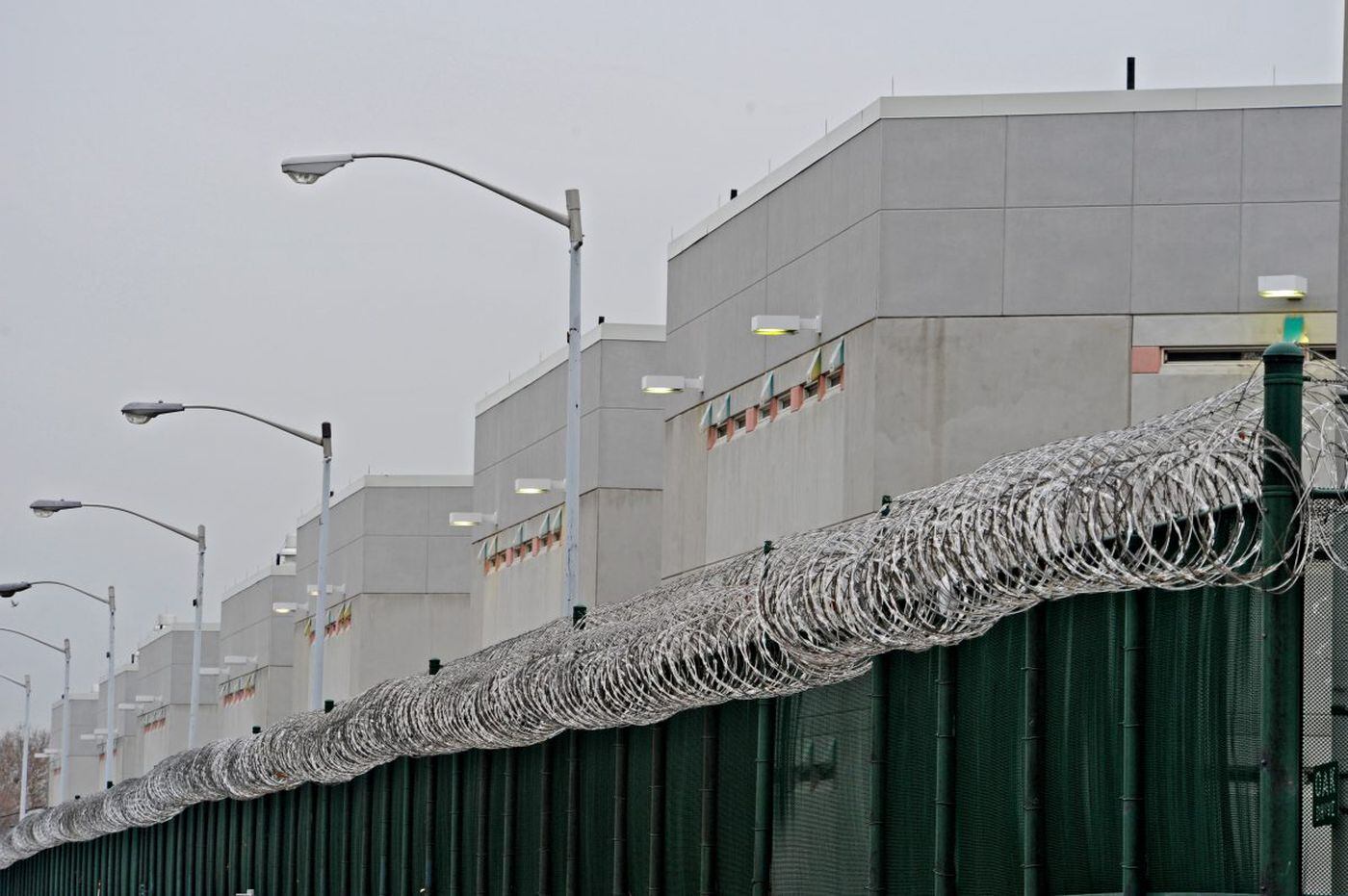 Behind the fence and the razor coil wire on top is the Curran-Fromhold Correctional Facility on State Road in Philadelphia.