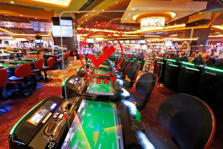 Lawmakers have once again considered expanding gaming to cope with budget woes. Here, plexiglass dividers separate video gaming machines at Rivers Casino in Pittsburgh on Monday, June 8, 2020. (AP Photo/Gene J. Puskar)