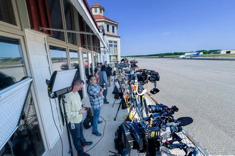 Members of the media line up for coverage of the arrival of immigrants at the Delaware Costal Airport  in Georgetown, Del., on Tuesday.