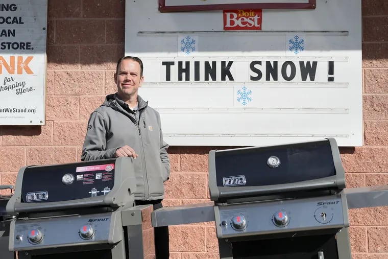 Owner Jeff Muth stands outside of Hardware Plus in Wayne. The store has not sold many snow-related items due to the unusually mild winter.