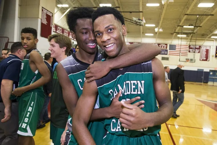 Camden Catholic’s basketball team, with juniors Uche Okafor (right) and Baba Ajike, will play in the reborn Seagull Classic this weekend at Holy Spirit High School.