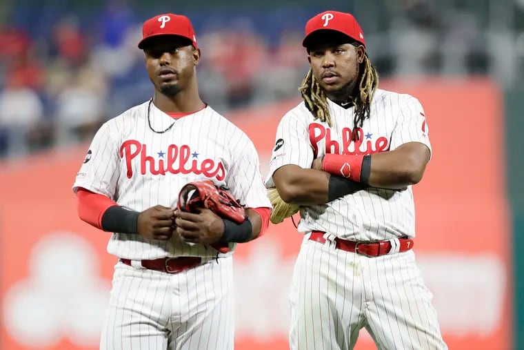 Maikel Franco, right, wasn't in the Phillies' lineup Tuesday night after not running hard on a grounder in Monday night's loss to the Dodgers. After similar incidents of not hustling last month, Jean Segura, left, wasn't removed from the lineup.