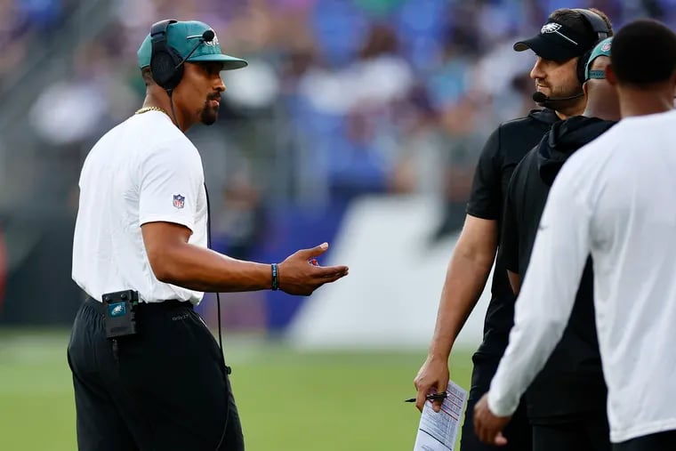 Philadelphia Eagles starting quarterback Jalen Hurts in plain clothes on the sidelines during the preseason game against the Baltimore Ravens at M&T Bank Stadium in Baltimore, Md on Saturday, August 12, 2023. Hurts is not playing.
