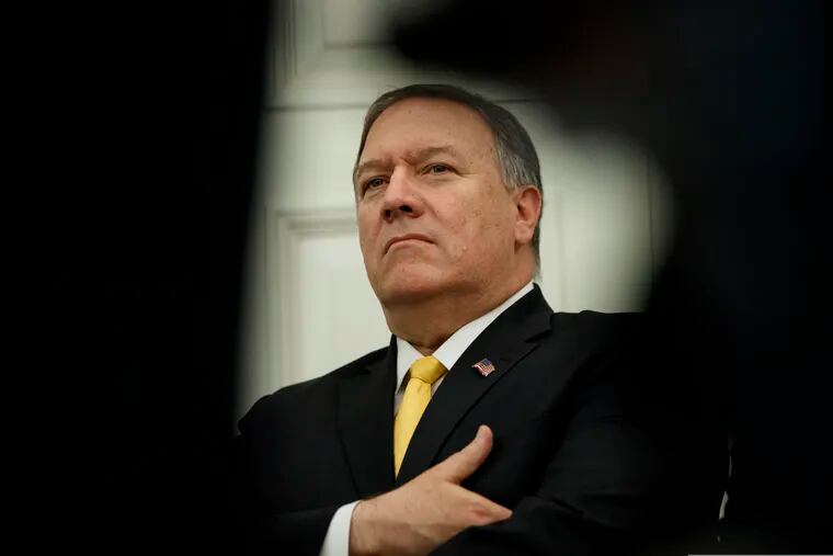 FILE - In this July 26, 2019, file photo, U.S. Secretary of State Mike Pompeo stands in the Oval Office of the White House in Washington. Pompeo said Thursday that the Trump administration is focused on helping two Canadians detained by China.