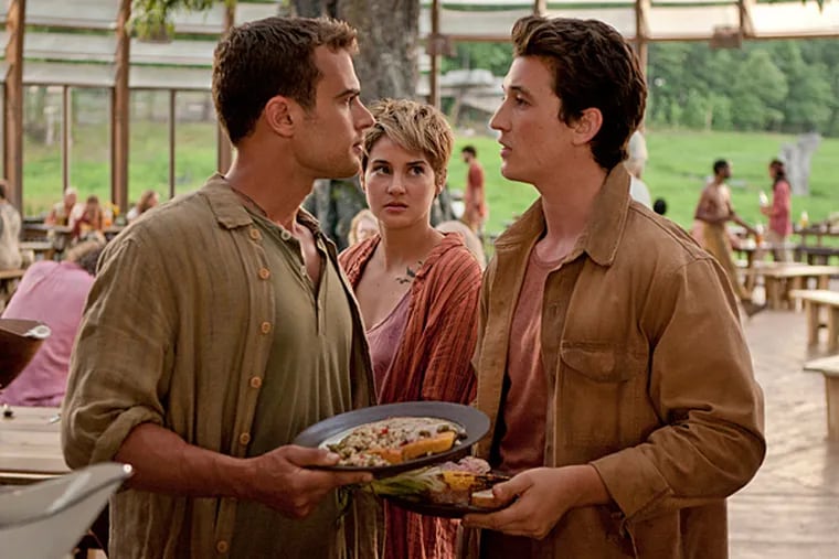 Four (Theo James, left), Tris (Shailene Woodley, center) and Peter (Miles Teller, right) in "The Divergent Series: Insurgent." (Andrew Cooper/Lionsgate/TNS)