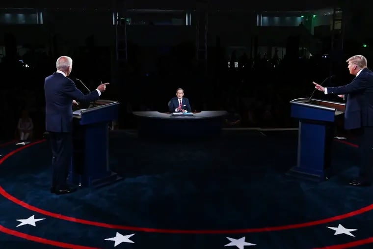 President Donald Trump (right) and former Vice President Joe Biden (left) participate in the first presidential debate with moderator Chris Wallace on Tuesday.