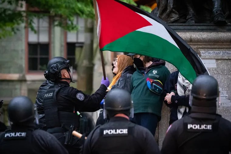 Police work to arrest protesters at the University of Pennsylvania campus on Friday.
