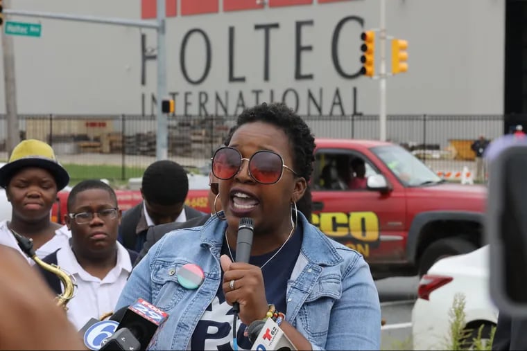 Ronsha Dickerson speaks about the comments made by Kris Singh, about the difficulty of attracting employees to Camden and work ethic of Camden residents, in front of Holtec International in Camden. DAVID SWANSON / Staff Photographer