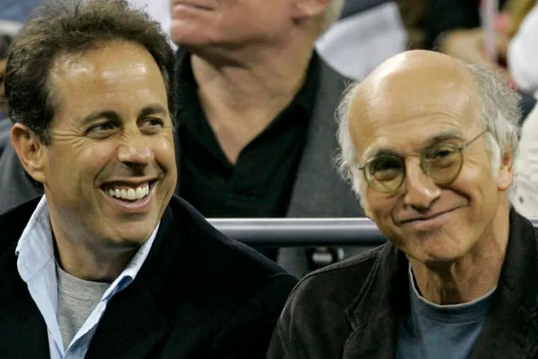 Comedian Jerry Seinfeld, left, with Larry David  during  the Venus Williams and Jelena Jankovic match at the US Open tennis tournament in New York, Wednesday, Sept. 5, 2007. (AP Photo/Darron Cummings)