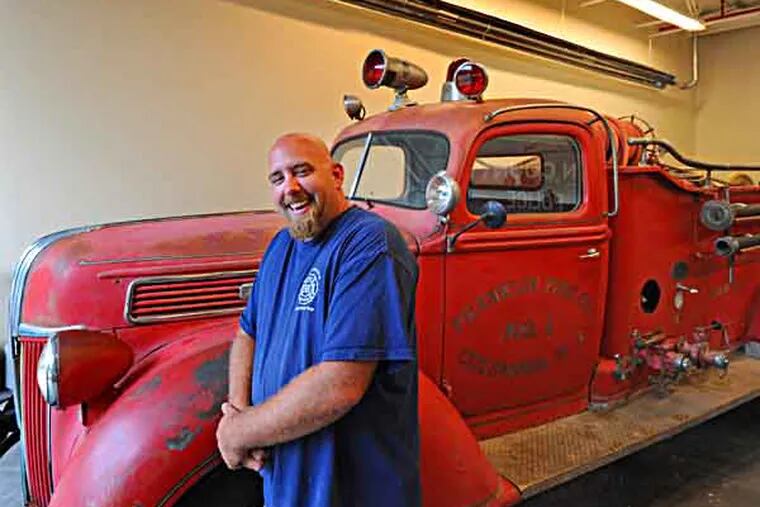 Franklin Fire Co. # 1, in Mansfield Twp, NJ,  is raising money to restore a 72-year-old truck the volunteer company recently obtained on Craigslist.  Here, Barry Rasmussen, vp of the fundraising committee with the 1941 truck on on July 23, 2013.   ( APRIL SAUL / Staff )