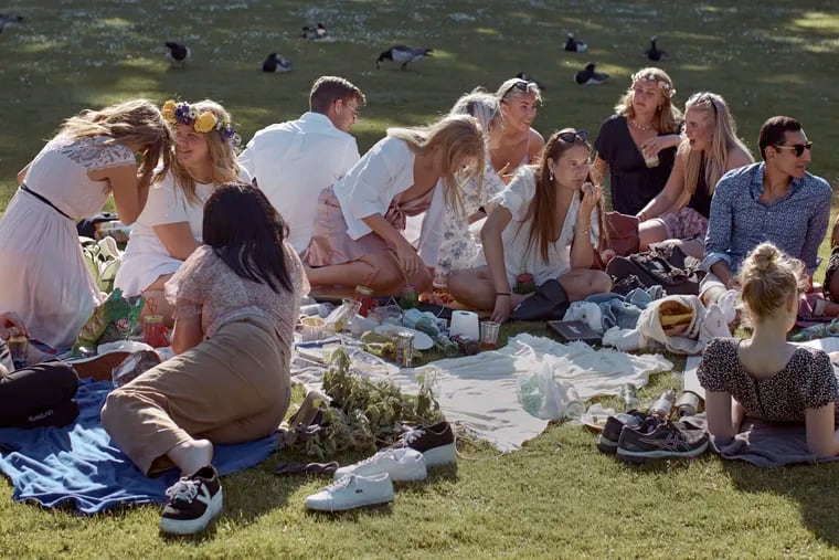 FILE - In this Friday June 19, 2020 file photo people picnic during the annual Midsummer celebrations in Stockholm, Sweden. Sweden's "herd immunity" low-key approach to coronavirus lockdowns captured the world's attention when the pandemic first hit Europe.