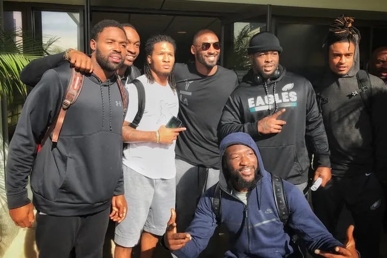 Kobe Bryant (wearing glasses) met with the Eagles on Friday in Costa Mesa, Calif.