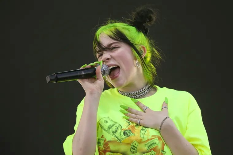 FILE - In this Oct. 5, 2019 photo, Billie Eilish performs during the first weekend of the Austin City Limits Music Festival in Zilker Park in Austin, Texas. Eilish will be the first recipient of the Apple Music Award for global artist of the year, one of three honors for the pop singer. Apple announced Monday that Eilish’s “When We All Fall Asleep, Where Do We Go?” has been named album of the year.  Eilish and her brother Finneas will also receive songwriter of the year honors. (Photo by Jack Plunkett/Invision/AP, File)