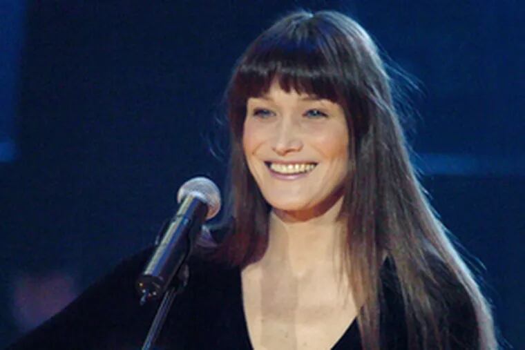 Carla Bruni , performing in 2004.