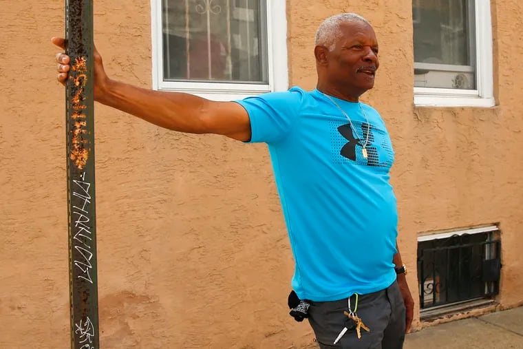 Herbert Hawkins, 71, stands outside of his Brewerytown home.