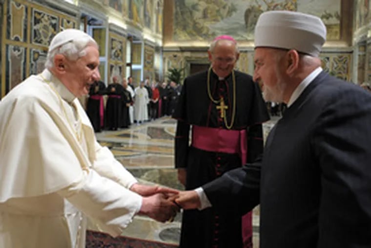 Pope Benedict XVI (left) greets Mustafa Ceric, the head of the Bosnia Islamic Community, during a three-day Catholic-Muslim conference at the Vatican. Benedict said that adherents of both religions needed to overcome their misunderstandings.