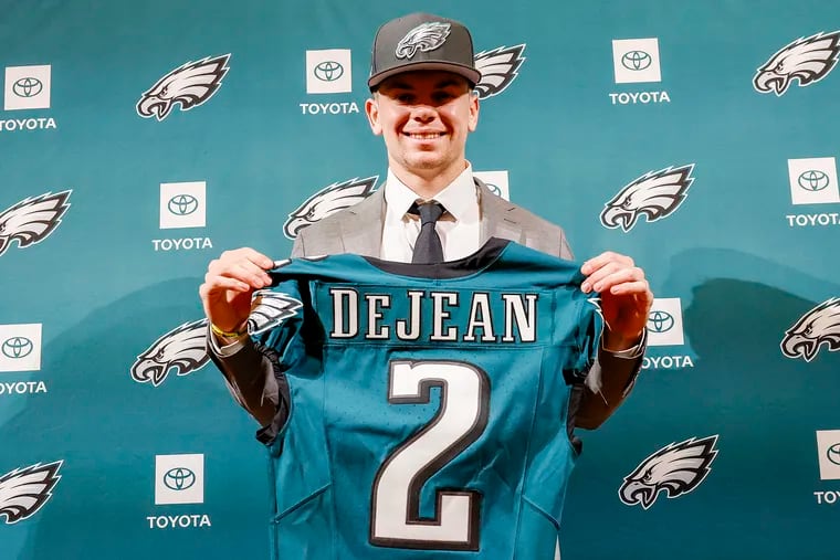 Eagles second-round pick Cooper DeJean holds his jersey after meeting with the media during a introduction press conference at the NovaCare Complex in South Philadelphia on Saturday, April 27, 2024.