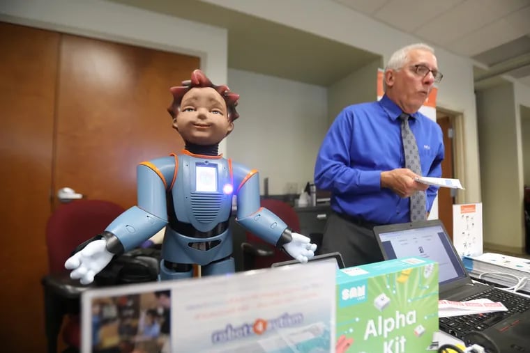Mark Losey, of Educational Technology Consultants, based in Dallas, Texas, displays "Milo," of robots4autism at the first STEM expo for area educators at the CCIU Educational Service Center in Downington.