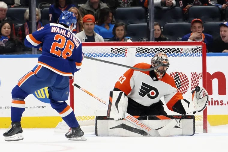 Samuel Ersson of the Philadelphia Flyers stops Oliver Wahlstrom of the New York Islanders in the shootout at UBS Arena on November 25, 2023 in Elmont, New York. (Photo by Bruce Bennett/Getty Images)