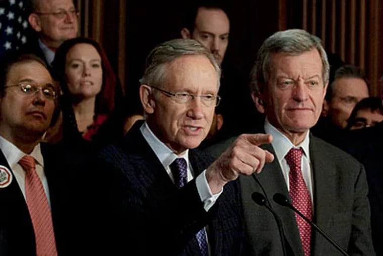Senate Majority Leader Harry Reid of Nev. gestures during a health care rally on Capitol Hill in Washington on Tuesday. (AP Photo/Harry Hamsburg)