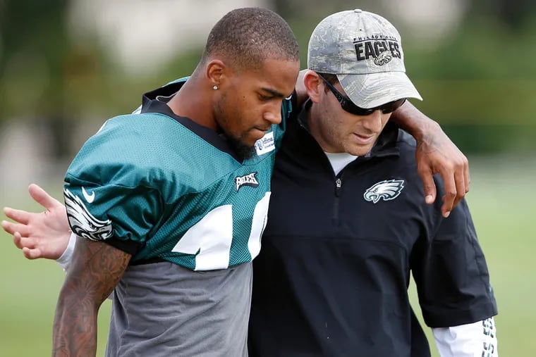 DeSean Jackson, left, with his arm around general manager Howie Roseman at training camp in 2012.