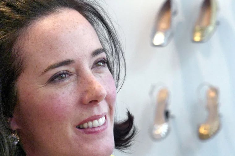 FILE – In this May 13, 2004 file photo, the late designer Kate Spade poses with shoes from her next collection in New York. AP Photo/Bebeto Matthews, File)