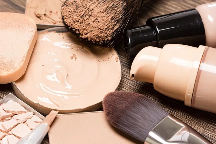 Basic makeup products for flawless complexion: foundation, concealer, powder, cosmetic sponge, professional makeup brushes.