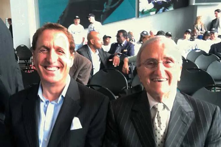 Developer Bart Blatstein and businessman Joseph Procacci - competitors for Philadelphia's second casino license - share a laugh at Wednesday's public hearing before the Pennsylvania Gaming Control Board at Lincoln Financial Field. (By Suzette Parmley)