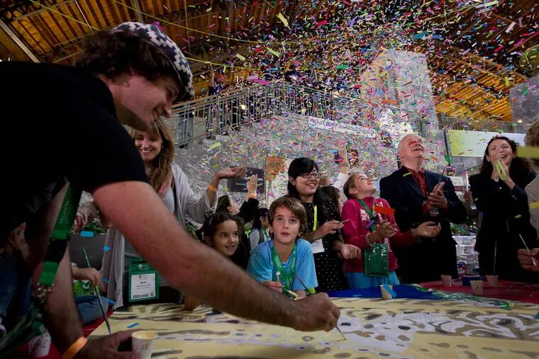 The Walker family from Argentina participated in breaking the Guinness Book of World Records for number of people painting by numbers. The mural titled The Sacred Now: Faith and Family in the 21st Century.  ( ALEJANDRO A. ALVAREZ / Staff Photographer )
