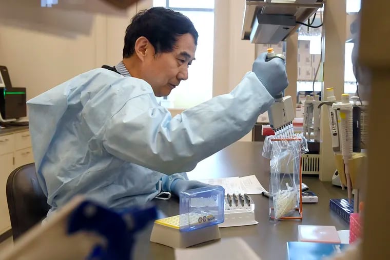 Microbiologist Xiugen Zhang runs a Polymerase Chain Reaction, or PCR, test at the Connecticut State Public Health Laboratory, in Rocky Hill, Conn. U.S. health officials say more public and private laboratories are now able to test for the new coronavirus.