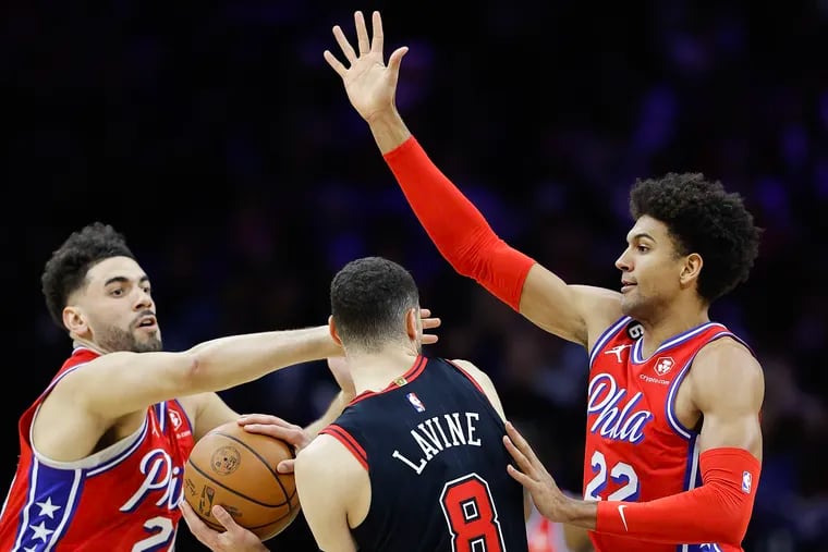 Sixers guard Matisse Thybulle (left) and forward Georges Niang defend Chicago Bulls guard Zach LaVine on Jan. 6.