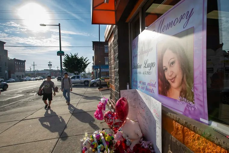 Memorial to Christine Lugo, manager at Dunkin' Donuts at Lehigh Avenue at 6th Street as seen on Tuesday morning June 8, 2021. The store remains closed. Lugo was killed during a robbery when she was opening the store on Saturday, June 5, 2021.