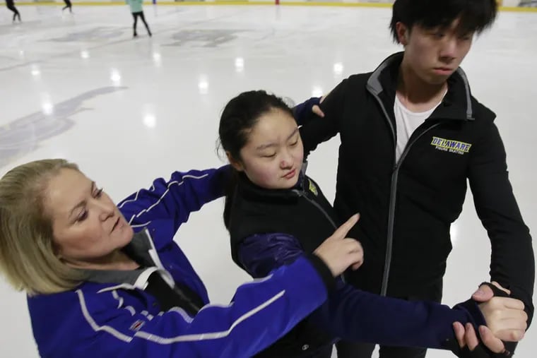 Former U.S. Olympic ice dancer Suzy Semanick (left), coaching ice dancers Cherri Chen (center) and Yuanshi Jin at University of Delaware’s Gold rink.