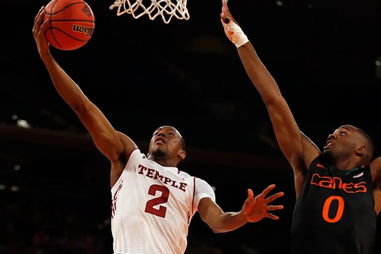 Temple's Will Cummings lays up the ball against Miami's Ja'Quan
Newton during the first half of the NIT semifinals at Madison Square
Garden in New York City. (Yong Kim/Staff Photographer)