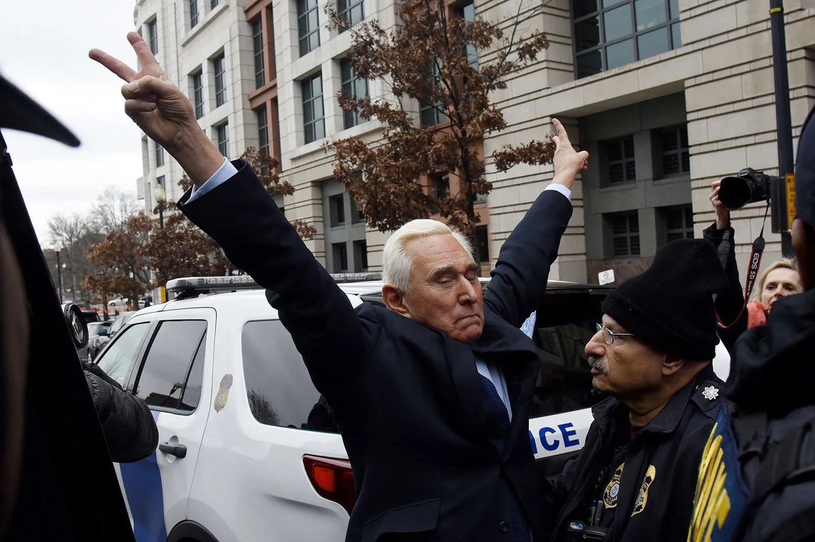 Roger Stone, a longtime adviser to then President Donald Trump, gestures as he leaves the Prettyman United States Courthouse in Washington, D.C., after facing charges from Special Counsel Robert Mueller that he lied to Congress and engaged in witness tampering, on Jan. 29, 2019. Stone was convicted but later pardoned by Trump. He is now under investigation for a possible role in instigating the Capitol riots.