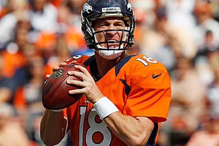 Peyton Manning has agreed to become a minority owner of the Memphis Grizzlies. (David Zalubowski/AP)